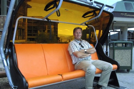 Mike Goar, managing director of The Canyons in Park City, Utah, tries one of the ski resort's new chairs, which can warm up to 55 degrees and have a bubble that swings over passengers like a pair of goggles in Park City, Utah. 